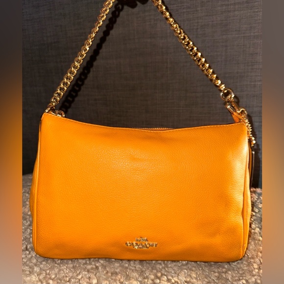 Coach Handbags - Coach Carrie  🧡 handbag with Gold plated chain.